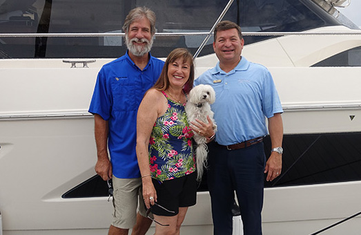 Larry and April Smith along with their dog Abby, who their boat is named after - One Eye Dog