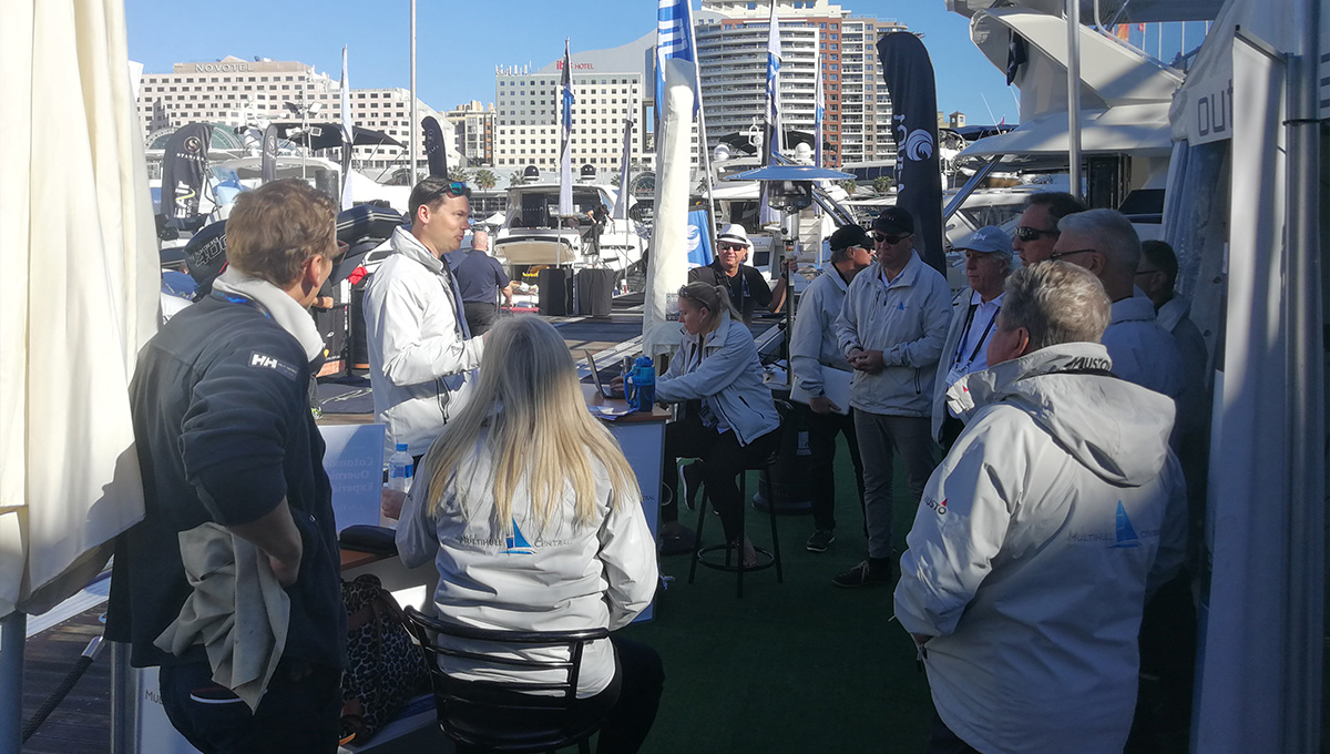 dealer on the dock with team at sydney international boat show