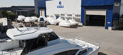 Aquila factory exterior with boats outside