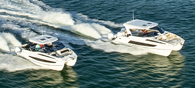 Aerial photo of Aquila Sport Power Catamarans 32 and 36 running on the water