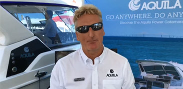 Harry in front of camera at a boat show to talk about Aquila