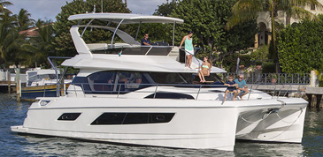 People relaxing aboard the Aquila 44 boat on the water