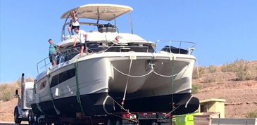 Aquila 44 Power Catamaran hitched to the back of a semitruck