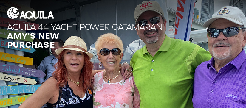 4 people standing and looking into the camera. One of them is Amy - the new owner of Aquila 44 Yacht Power Catamaran