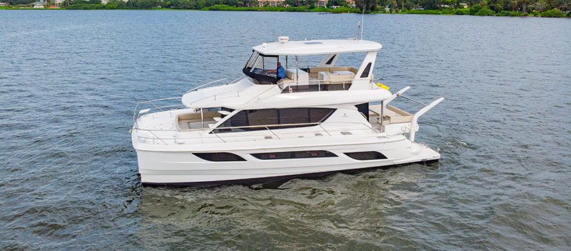 A profile shot of the Aquila 48 power catamaran in the water