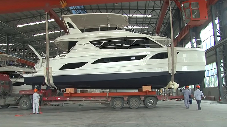 Aquila Boat loaded on trailer in factory
