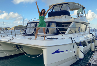 A Sports Illustrated swimsuit model aboard a MarineMax Vacations power catamaran