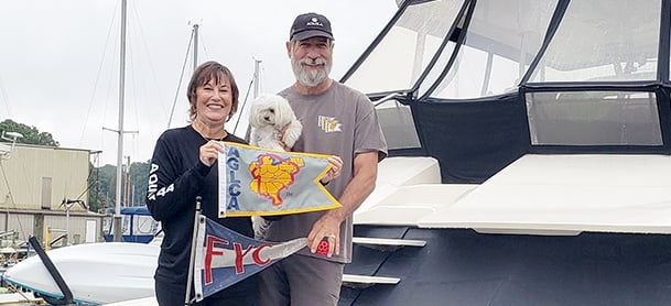 couple standing in front of an Aquila