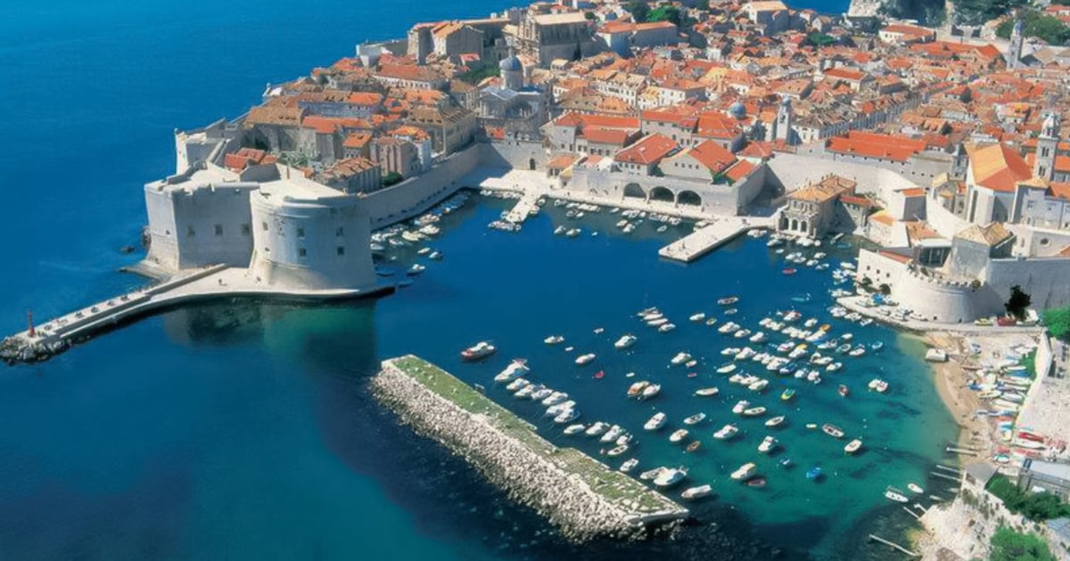 top view of ocean and town in Europe with boats in the water